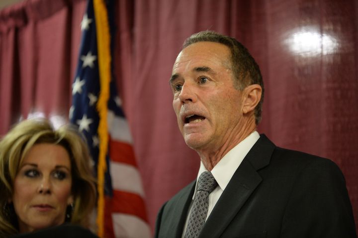Rep. Chris Collins (R-N.Y.), with his wife Mary at his side, holds a news conference on Aug. 8, 2018, in Buffalo, New York, in response to his indictment for insider trading.