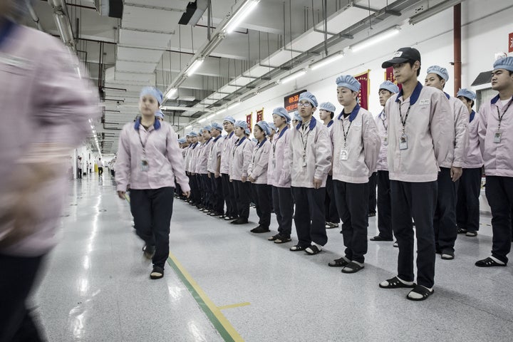 Workers in a Shanghai factory where Apple products are made.