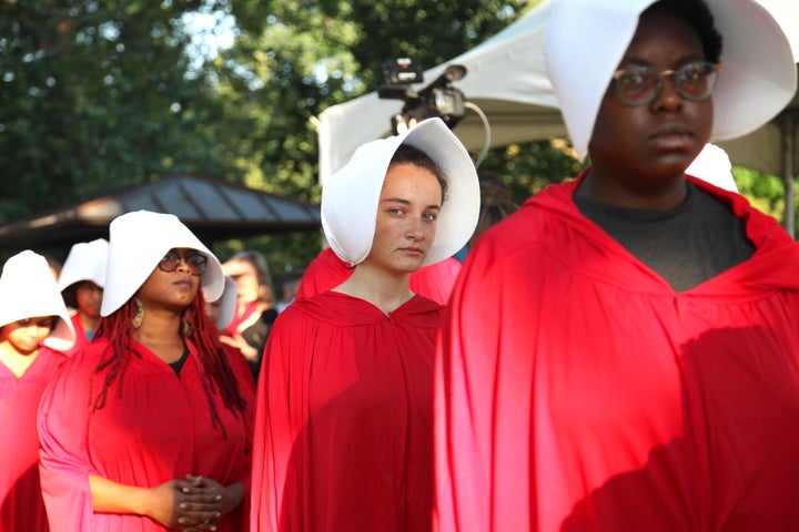 Margot Bloch (center) dressed as a Handmaid on Sept. 4, 2018