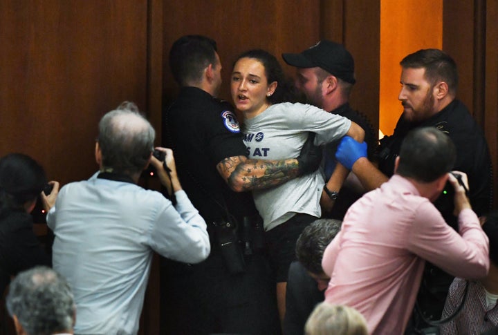 Margot Bloch being detained by police after she disrupted Brett Kavanaugh's Supreme Court confirmation hearing on Sept. 4, 20