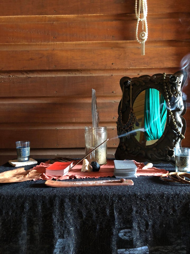 Creating an altar to honor your relationship is a great way to set the space for a closing ceremony. You may add small sentimental objects, such as photos or notes; burn incense, a candle, or sage; and/or collect plants or flowers to add vibrancy to the space.