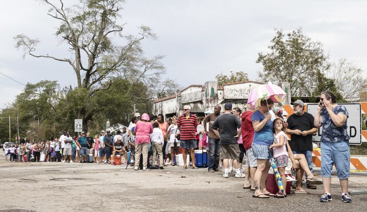 Dozens of people in Wilmington, North Carolina, wait in line for ice on Sept. 17, after Hurricane Florence hit. The storm’s wind speeds fell quickly after it made landfall, but those weren’t its most hazardous aspects.