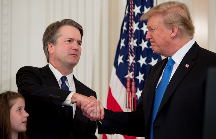 Supreme Court nominee Brett Kavanaugh and President Donald Trump share a handshake before the sexual assault allegation came out.