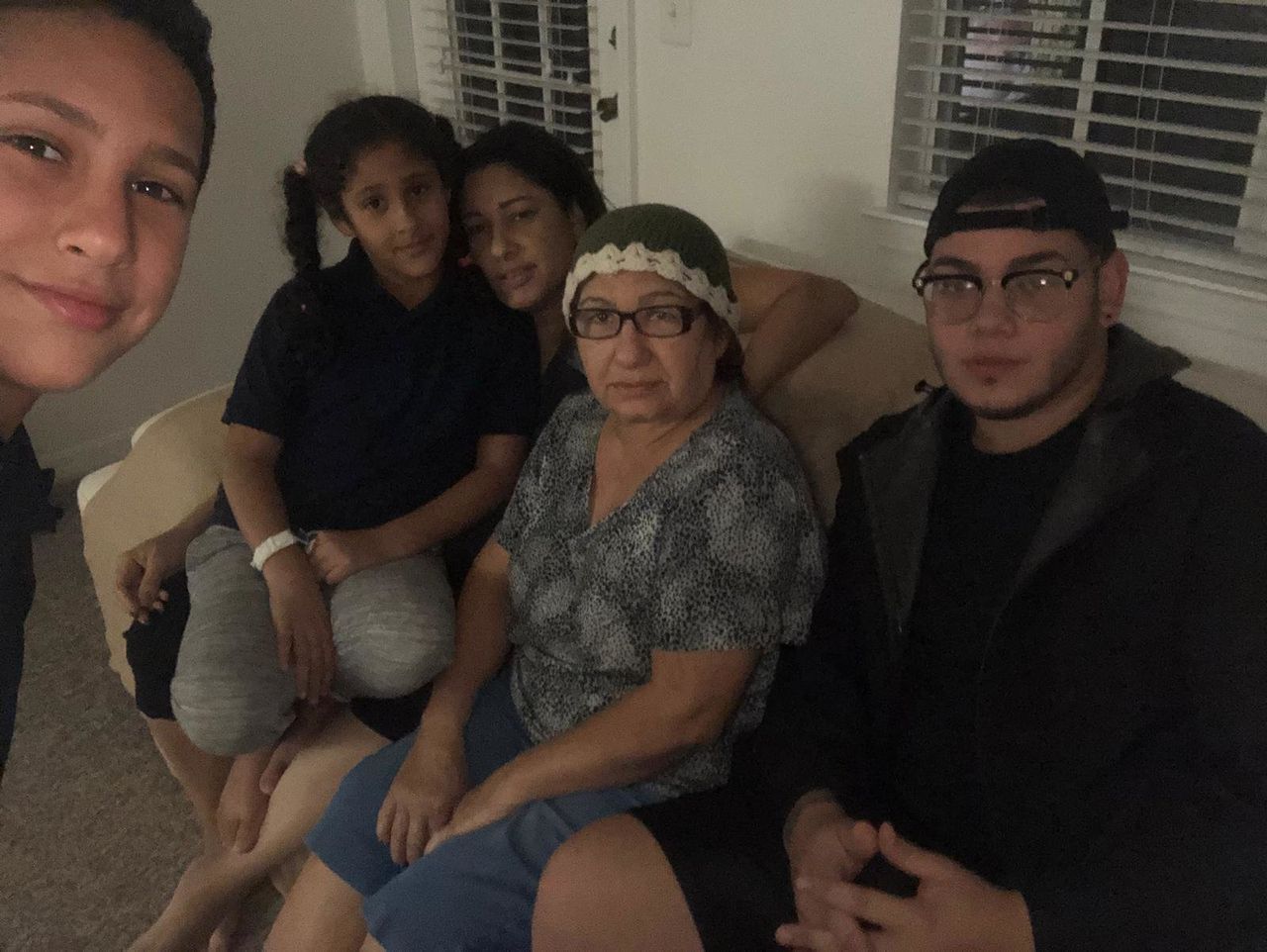 Amneris Ortiz, her mother and three kids in their rental apartment