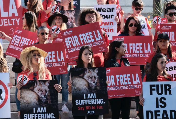 Protesters call for the ban of fur sales in front of City Hall in Los Angeles on Tuesday.