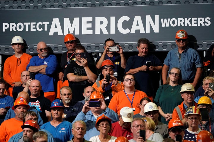 Steelworkers watch as President Donald Trump discusses trade in Granite City, Illinois, U.S., on July 26, 2018.