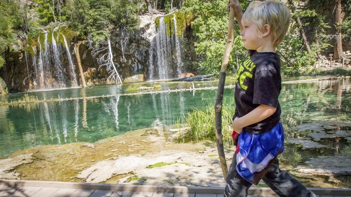 Ethan Patterson, 5, walks along the boardwalk after making the trek up to Hanging Lake in Glenwood Canyon, Colorado. Up to 1,200 visitors venture to the lake every day in the summer, the U.S. Forest Service says. 