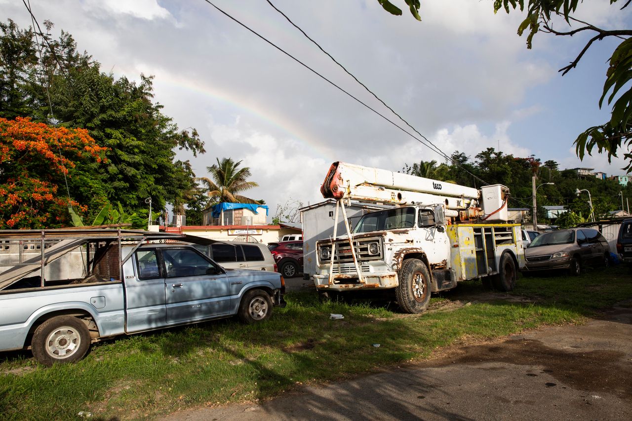 Carrion raised $2,500 from local residents and bought a used bucket truck (right), with which he and others repaired power lines.
