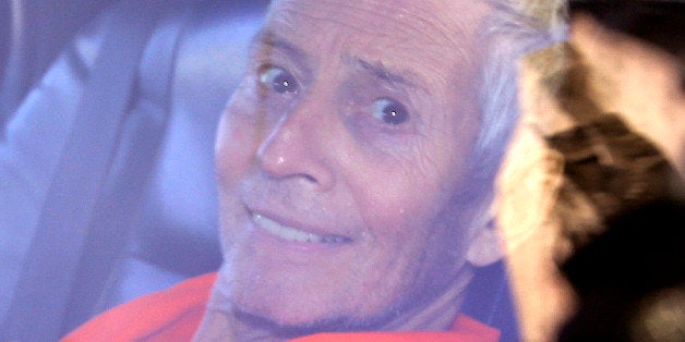 FILE - In this Tuesday, March 17, 2015 file, Millionaire Robert Durst is escorted from Orleans Parish Criminal District Court