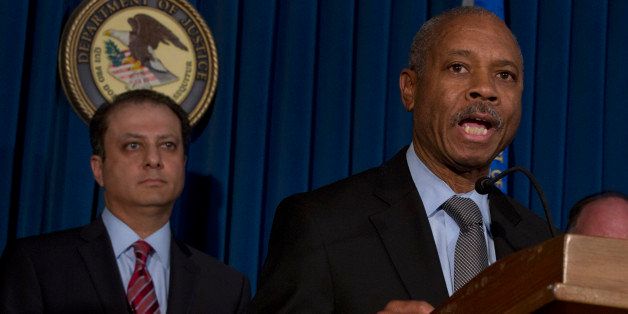 Bronx borough District Attorney Robert Johnson, right, addresses a news conference, accompanied by U.S. Attorney Preet Bharara, in New York, Thursday, April 4, 2013. New York state Assemblyman Eric Stevenson, a Democrat, was arrested in a bribery investigation that also led another state assemblyman charged with crimes to cooperate with the understanding that he would resign his position with the arrests of Stevenson and four other defendants.(AP Photo/Richard Drew)