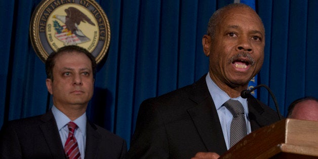 Bronx borough District Attorney Robert Johnson, right, addresses a news conference, accompanied by U.S. Attorney Preet Bharara, in New York, Thursday, April 4, 2013. New York state Assemblyman Eric Stevenson, a Democrat, was arrested in a bribery investigation that also led another state assemblyman charged with crimes to cooperate with the understanding that he would resign his position with the arrests of Stevenson and four other defendants.(AP Photo/Richard Drew)