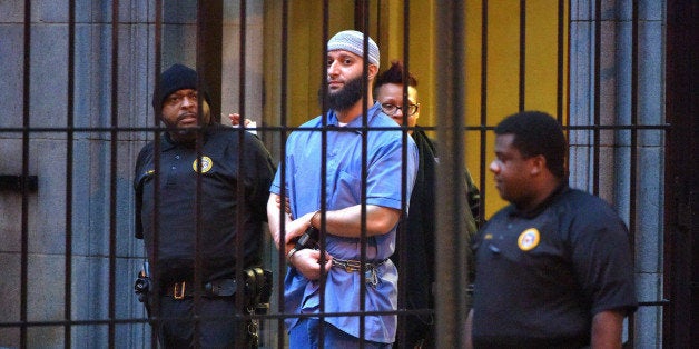 Officials escort 'Serial' podcast subject Adnan Syed from the courthouse following the completion of the first day of hearings for a retrial in Baltimore on Wednesday, Feb. 3, 2016. (Karl Merton Ferron/Baltimore Sun/TNS via Getty Images)