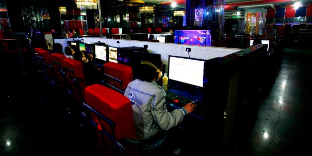 Customers use computers at an internet cafe in Hami, northwest China's Xinjiang region on January 16, 2011. China now has mor