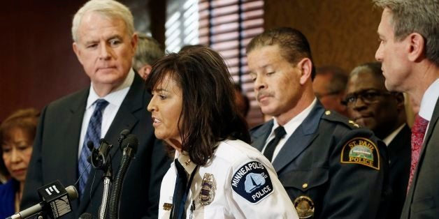 Minneapolis Police Chief Renee Harteau addresses a Regional Gun Summit news conference hosted by Minneapolis Major R.T. Rybak, right, and Milwaukee Mayor Tom Barrett, left, on Thursday, Jan. 10, 2013, in Minneapolis. The summit brought together state and federal law enforcement, prosecutors, mayors and other experts, marking the first time such a broad cross-section has gathered to tackle the gun problem issue face to face. Second from right is St. Paul Police Chief Thomas Smith. (AP Photo/Jim Mone)