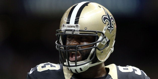 NEW ORLEANS, LA - NOVEMBER 24: Junior Galette #93 of the New Orleans Saints participates in warmups prior to a game against