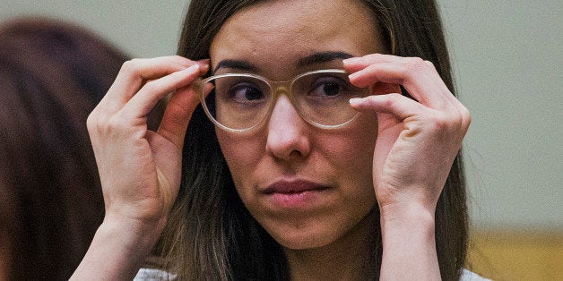 Jodi Arias adjusts her glasses during her sentencing retrial at Maricopa County Superior Court, Wednesday, Feb. 18, 2015, in Phoenix. Arias was convicted of first-degree murder in May 2013 in the 2008 killing of former boyfriend Travis Alexander. However, jurors deadlocked on her punishment. (AP Photo/The Arizona Republic, Tom Tingle, Pool)