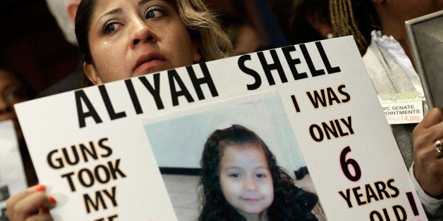 WASHINGTON, DC - SEPTEMBER 18: Diana Aguilar holds a photo of her 6 year old daughter Aliyah Shell during a press conference at the U.S. Capitol calling for gun reform legislation and marking the 9 month anniversary of the shooting at Sandy Hook Elementary school September 18, 2013 in Washington, DC. With the shooting at the Washington Navy Yard earlier this week, gun reform activists are renewing their call for national reformation of existing gun laws. Aliyah Shell was killed when she was by multiple gunshot wounds outside her home in Chicago in 2012. (Photo by Win McNamee/Getty Images)