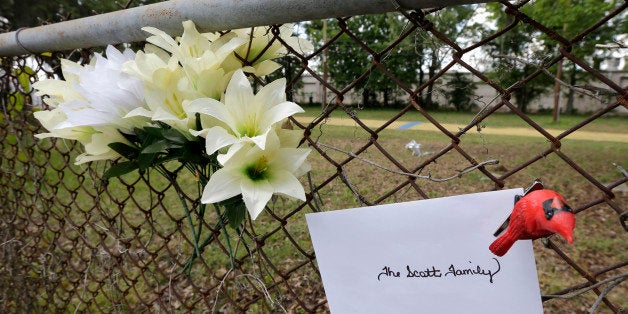 Memorials are placed near the site where Walter Scott was killed in North Charleston, S.C., Wednesday, April 8, 2015. Scott was killed by a North Charleston police officer after a traffic stop on Saturday. The officer has been charged with murder. (AP Photo/Chuck Burton)