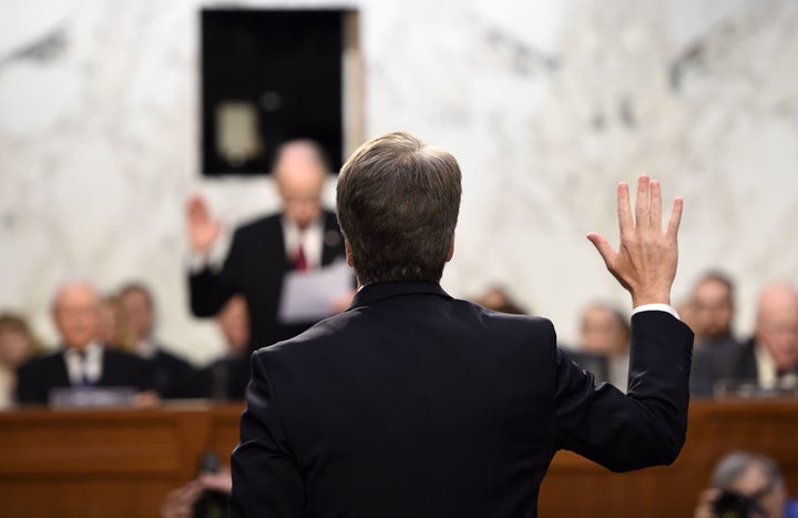 Kavanaugh is sworn in by the Chairman of the U.S. Senate Judiciary Committee Chuck Grassley, during his U.S. Senate Judiciary Committee confirmation hearing to be an associate justice on the U.S. Supreme Court on Sept. 4, 2018.