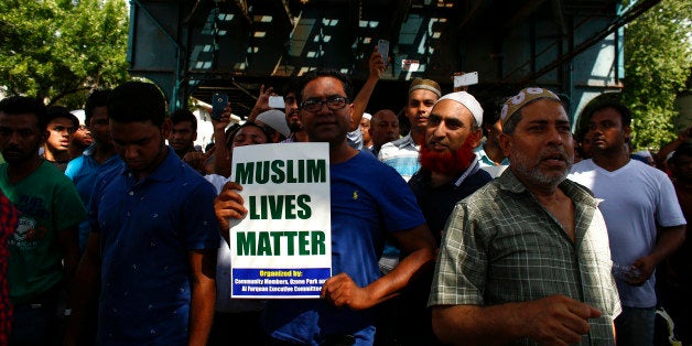 Community members march in protest in the streets after funeral prayers were given for Imam Maulama Akonjee and friend Thara Uddin August 15, 2016 in New York. New York police were questioning a suspect on Monday in connection with the double murder of the imam and his assistant near their mosque in Queens. Akonjee, 55, who migrated to the United States from Bangladesh, and his assistant, 64-year-old Thara Uddin, were shot dead in broad daylight August 13, 2016 in the Ozone Park neighborhood. / AFP / KENA BETANCUR (Photo credit should read KENA BETANCUR/AFP/Getty Images)