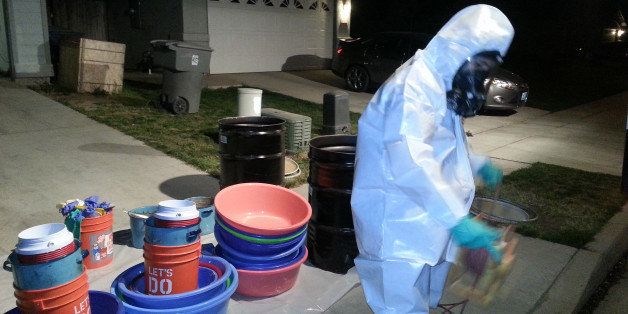 In this March 2014 photo provided by PARC Environmental, Jeff Davis, a hazardous materials specialist for PARC Environmental, cleans up a meth conversion lab inside a house in Madera, Calif. Authorities in Californiaￃﾢￂﾀￂﾙs Central Valley say that in recent years they have begun to see more meth dissolved as liquid and put into tequila bottles or plastic detergent containers to smuggle it across the border from Mexico. Once in the Central Valley, it is converted into crystals, itￃﾢￂﾀￂﾙs most sought-after form on the street. In the seedy underworld of methamphetamine, traffickers have turned to disguising the drug as a liquid to boost chances of smuggling it into the United States from Mexico without getting caught.(AP Photo/PARC Environmental)