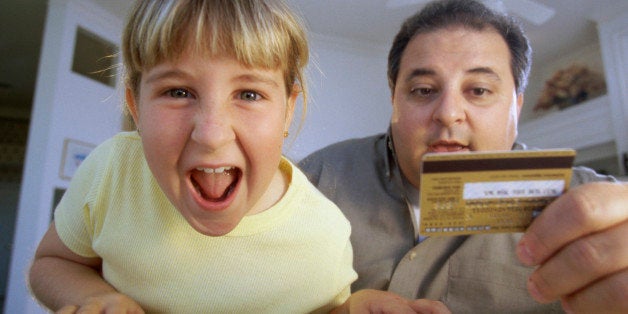 Portrait of a girl and her father in front of a computer