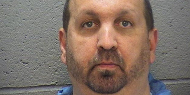 This image provided by the Durham County Sheriff's Office shows a booking photo of Craig Stephen Hicks, 46, who was arrested