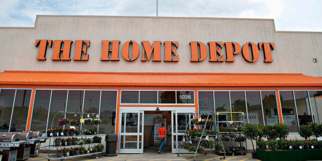 A U.S. flag flies above the entrance of a Home Depot Inc. store in Peoria, Illinois, U.S., on Monday, May 19, 2014. Home Depo