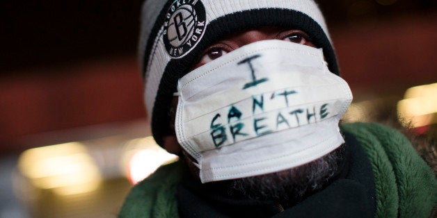A protestor attends a rally outside the Barclays Center against a grand jury's decision not to indict the police officer invo