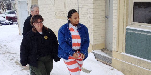 In this image from video provided by KCRG TV, Kristen Smith arrives for a hearing Friday, Feb. 14, 2014 in Tipton, Iowa. Smith, charged with kidnapping her half sister's newborn from Wisconsin, waived the right to challenge her extradition on a warrant from Texas charging her with tampering with government records. Federal prosecutors could take her into custody at any time in the kidnapping case. (AP Photo/KCRG TV, Mark Carlson)
