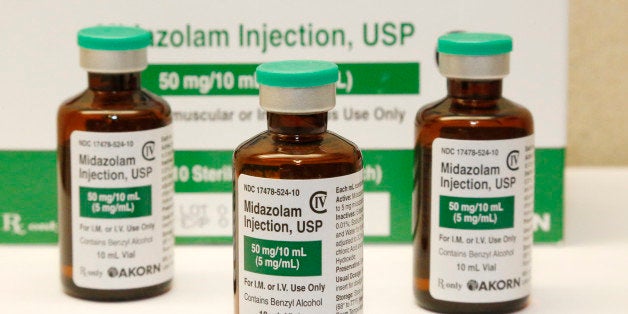 FILE - This July 25, 2014 file photo shows bottles of the sedative midazolam at a hospital pharmacy in Oklahoma City. Oklahoma plans to resume executions Thursday, Jan. 15, 2015, after botching its last one and will use the same three-drug method as a Florida lethal injection scheduled for the same day. The drug mixture begins with the sedative midazolam and includes the same drugs used in Oklahomaᅢ까タᅡルs botched execution of Clayton Lockett, who writhed on the gurney and moaned after heᅢ까タᅡルd been declared unconscious. (AP Photo/File)