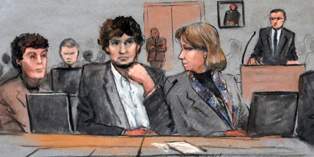 FILE - In this March 5, 2015 file courtroom sketch, Dzhokhar Tsarnaev, center, is depicted between defense attorneys Miriam Conrad, left, and Judy Clarke, right, during his federal death penalty trial in Boston. Prosecutors rested their case against Tsarnaev on Monday, March 30, 2015, after jurors saw gruesome autopsy photos and heard a medical examiner describe the devastating injuries suffered by the three people who died in the 2013 terror attack. (Jane Flavell Collins via AP, file)