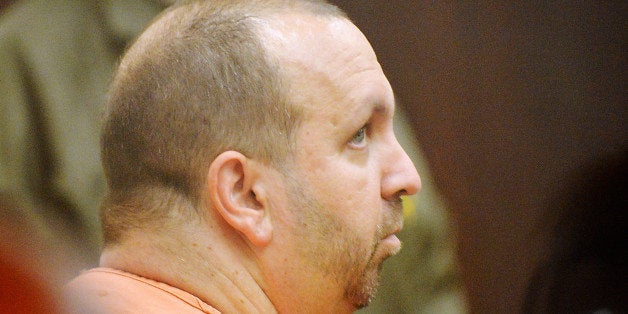 DURHAM, NC - FEBRUARY 11: Craig Stephen Hicks, 46, sits in the Durham County courtroom for his first appearance in the shooting deaths of three University of North Carolina students on February 11, 2015 in Durham, North Carolina. Hicks has been charged with three counts of first degree murder and is being held without bond. (Photo by Sara D. Davis/Getty Images)