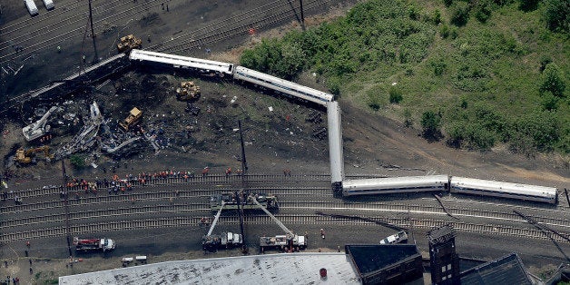 PHILADELPHIA, PA - MAY 13: Investigators and first responders work near the wreckage of Amtrak Northeast Regional Train 188,