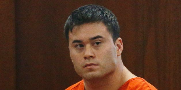 Daniel Holtzclaw, an Oklahoma City police officer accused of sexually assaulting women he encountered while on patrol in neighborhoods near the state Capitol, is pictured in a courtroom during a hearing on whether to cut his bond from $5 million to $139,000, in Oklahoma City, Wednesday, Sept. 3, 2014. (AP Photo/Sue Ogrocki)
