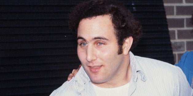 Police officers escort American accused (and ultimately convicted) serial killer David Berkowitz (left), known as the Son of Sam, into the 84th precinct station, New York, New York, August 10, 1977. (Photo by Robert R. McElroy/Getty Images)