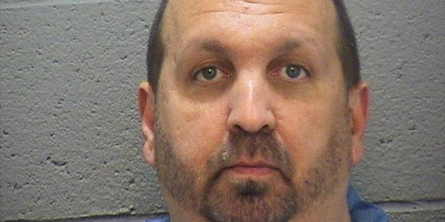 This image provided by the Durham County Sheriff's Office shows a booking photo of Craig Stephen Hicks, 46, who was arrested