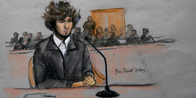 In this courtroom sketch, Boston Marathon bombing suspect Dzhokhar Tsarnaev is depicted sitting in federal court in Boston Th