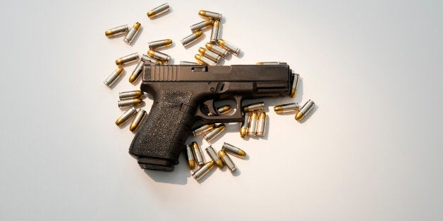 Semiautomatic handgun with high capacity magazine and live ammunition.