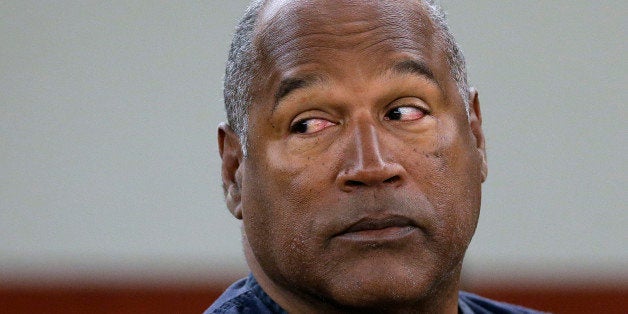 FILE - In this May 13, 2013 file photo, O.J. Simpson appears at an evidentiary hearing in Clark County District Court, in Las