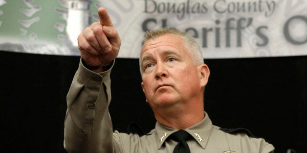 Douglas County Sheriff John Hanlin points to a reporter to take their question concerning the mass shooting at Umpqua Community College, during a news conference Friday, Oct. 2, 2015, in Roseburg, Ore. Armed with multiple guns, Chris Harper Mercer, walked into a class at the community college, Thursday, and opened fire, killing several and wounding others. (AP Photo/Rich Pedroncelli)