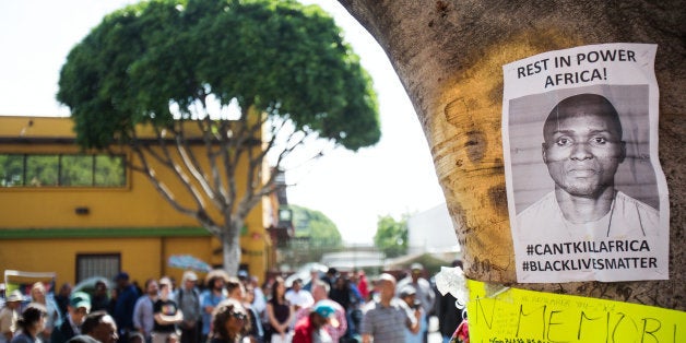 LOS ANGELES, CA - MARCH 19: A crowd gathers for the public memorial for Charly Leundeu Keunang in the Skid Row neighborhood
