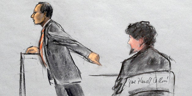 In this courtroom sketch, Assistant U.S. Attorney Aloke Chakravarty is depicted pointing to defendant Dzhokhar Tsarnaev, right, during closing arguments in Tsarnaev's federal death penalty trial Monday, April 6, 2015, in Boston. Tsarnaev is charged with conspiring with his brother to place two bombs near the Boston Marathon finish line in April 2013, killing three and injuring 260 people. (AP Photo/Jane Flavell Collins)