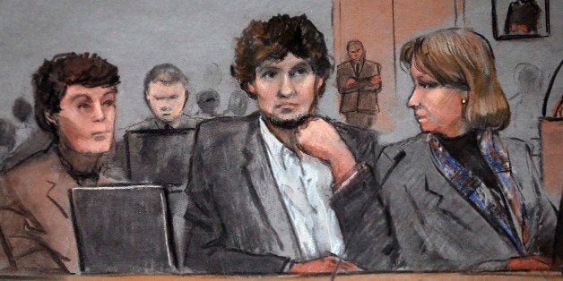 In this courtroom sketch, Dzhokhar Tsarnaev, center, is depicted between defense attorneys Miriam Conrad, left, and Judy Clarke, right, during his federal death penalty trial, Thursday, March 5, 2015, in Boston. Tsarnaev is charged with conspiring with his brother to place two bombs near the Boston Marathon finish line in April 2013, killing three and injuring 260 people. (AP Photo/Jane Flavell Collins)