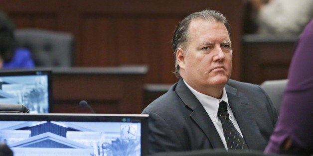 Michael Dunn sits in the courtroom as he waits for the afternoon session of his retrial to begin Friday, Sept. 26, 2014, in Jacksonville, Fla. The retrial of Dunn on murder charges for the shooting death of 17-year old Jordan Davis in a dispute over loud music at at Jacksonville gas station in November of 2012 continued Friday with more witnesses being brought to the stand. Dunn was found guilty of three counts of attempted murder and one count of shooting or throwing a deadly missile during his previous trial but the jury was deadlocked on the murder charge. (AP Photo/Pool Photo/The Florida Times-Union/Bob Self)