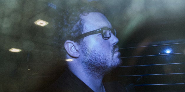 Rurik George Caton Jutting, a former Bank of America Corp. employee, leaves the Eastern Magistrates Court in a prison van in