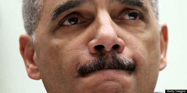 WASHINGTON, DC - MAY 15: U.S. Attorney General Eric Holder pauses as he testifies during a hearing before the House Judiciar