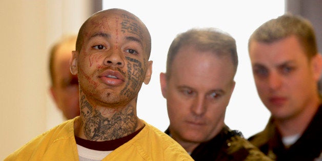 Nikko Jenkins is led by deputies at the Douglas County Courthouse in Omaha, Neb., Wednesday, Feb. 12, 2014. Jenkins, charged