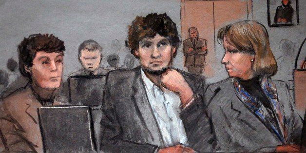 In this courtroom sketch, Dzhokhar Tsarnaev, center, is depicted between defense attorneys Miriam Conrad, left, and Judy Clarke, right, during his federal death penalty trial, Thursday, March 5, 2015, in Boston. Tsarnaev is charged with conspiring with his brother to place two bombs near the Boston Marathon finish line in April 2013, killing three and injuring 260 people. (AP Photo/Jane Flavell Collins)