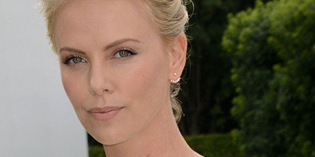PARIS, FRANCE - JULY 07: Charlize Theron attends the Christian Dior Show as part of Paris Fashion Week - Haute Couture Fall/Winter 2014-2015 at Musee Rodin on July 7, 2014 in Paris, France. (Photo by Foc Kan/WireImage)